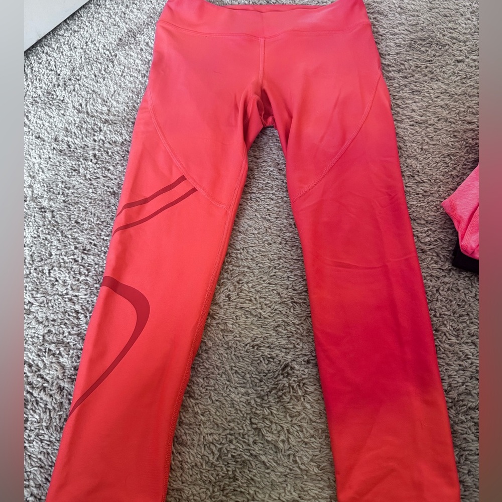 Neon pink/orange under armor leggings